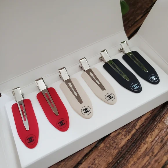 CHANEL | Accessories | Chanel Womans Hair Clips In Red Cream  display picture 2